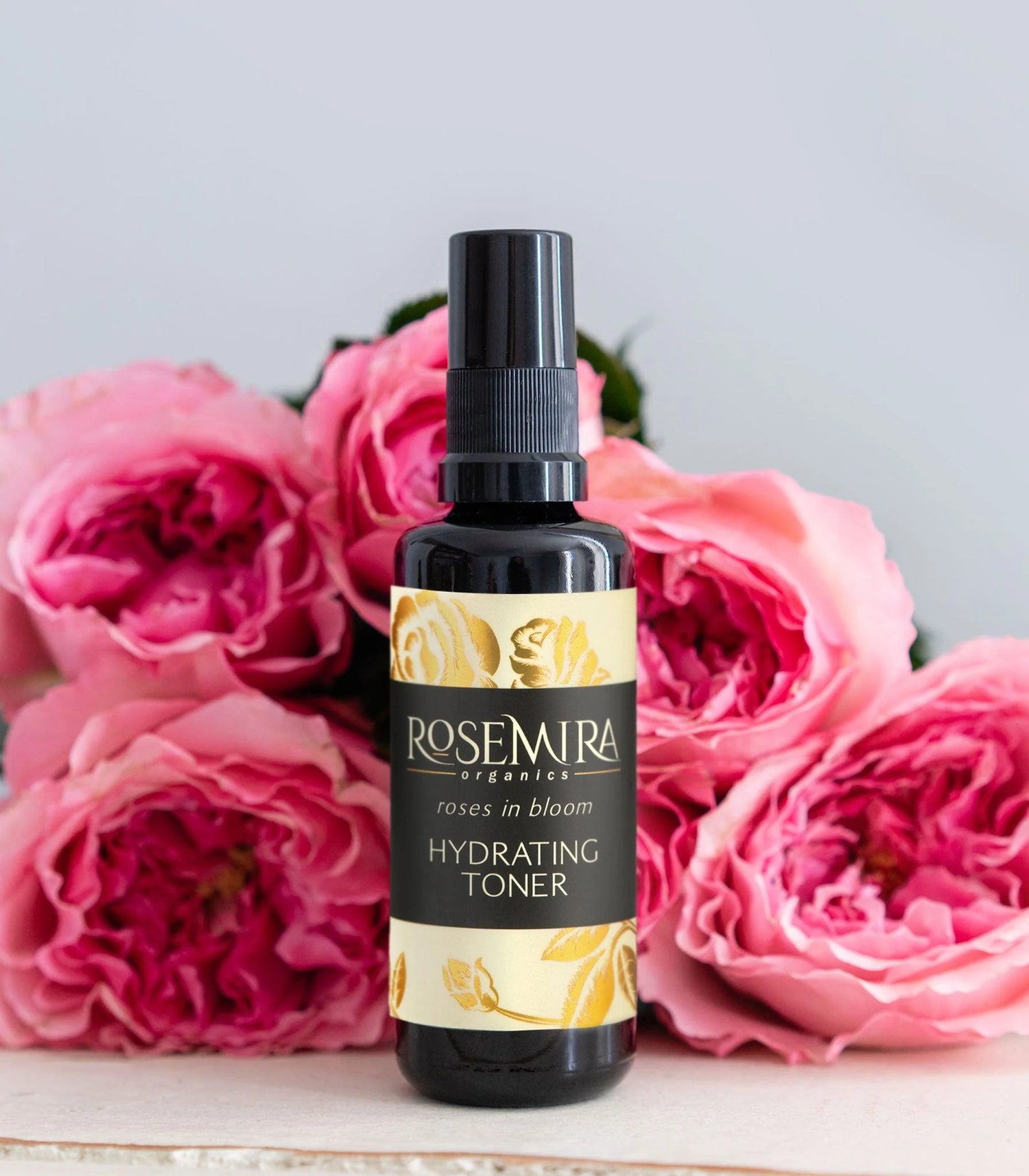 Rosemira Roses in Bloom Hydrating Toner – 1.7 oz glass spray bottle with elegant rose-themed label. A 100% natural, organic, vegan toner for all skin types, formulated with Rose Hydrosol, Neroli Hydrosol, and Rose de Mai Essential Oil. Finalist in the 2025 CertClean Beauty Awards.