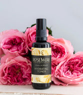 Rosemira Roses in Bloom Hydrating Toner – 1.7 oz glass spray bottle with elegant rose-themed label. A 100% natural, organic, vegan toner for all skin types, formulated with Rose Hydrosol, Neroli Hydrosol, and Rose de Mai Essential Oil. Finalist in the 2025 CertClean Beauty Awards.